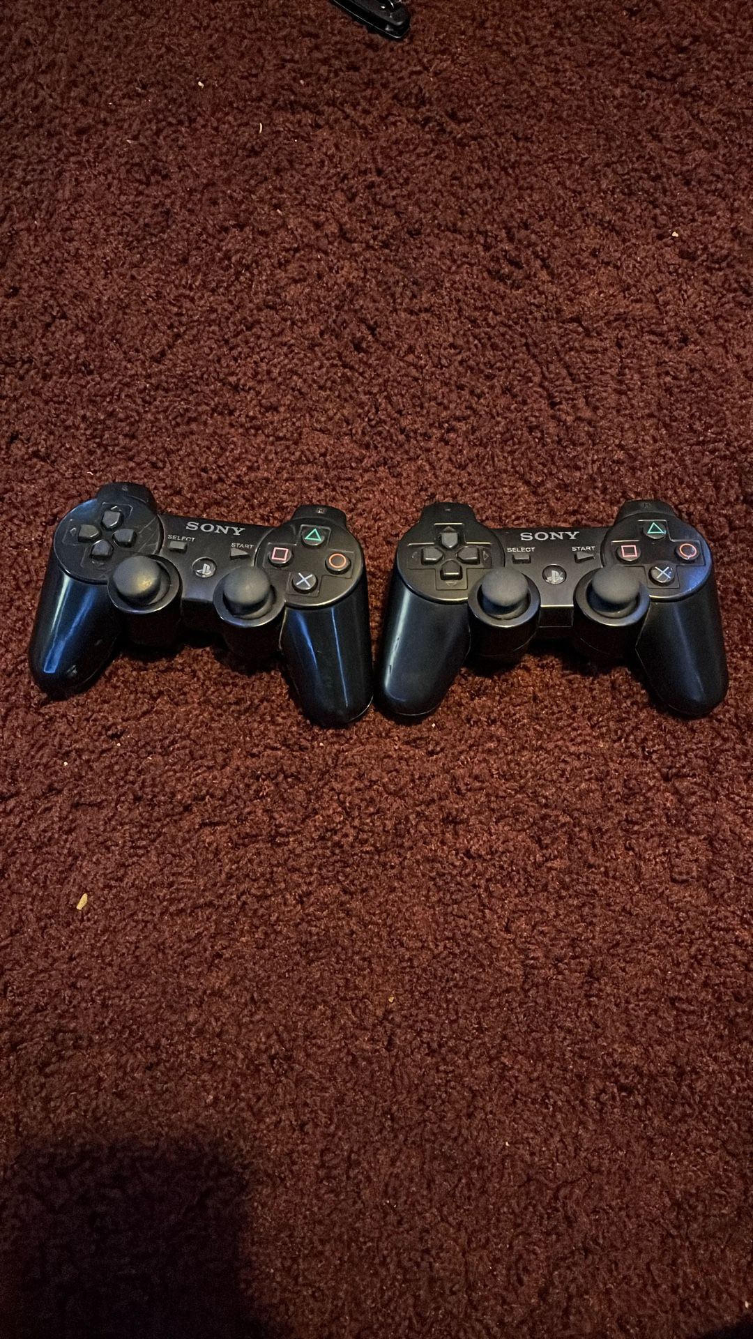 two Ps3 Controllers