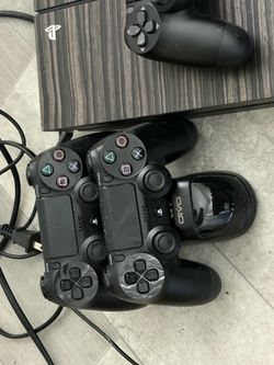 Playstation 4 w/ controllers, a camera and games