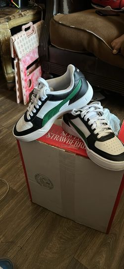 Green striped Puma shoes