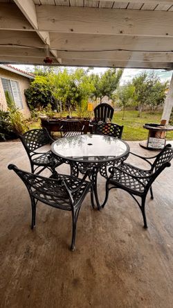 5 piece cast iron outdoor set with glass top table