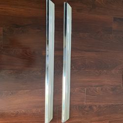 67 Impala fender skirt moldings New GM.