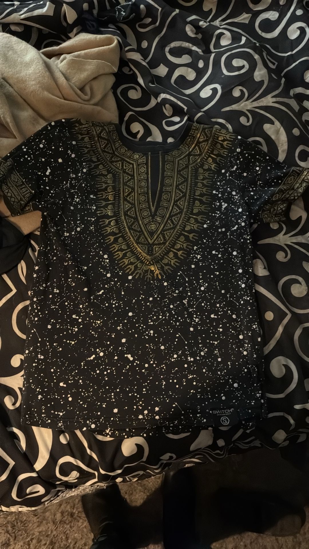 Nice shirt. Black with gold.