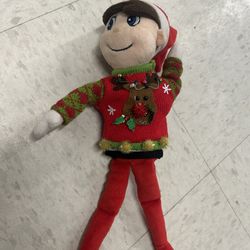 Elf on the Shelf stuffy with ugly Christmas sweater 