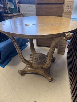 Round Wood Table with Ornate Carved Base