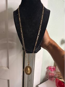 10kt gold figaro chain with VirginMary/JesusChris Pendant