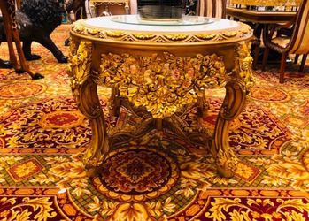 Center table: A Baroque revival marble-top occasional table with a gold-gilt carved wooden base. TIME PERIOD Late 19th Century ORIGIN Europe, likely F