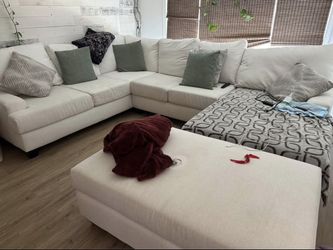Custom cream/off white performance fabric sectional couch with extra large ottoman