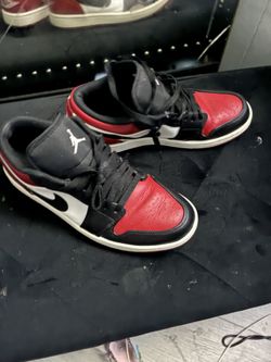 Women size 9 Jordan 1s low red and black
