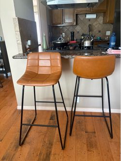 Brown leather bar stools