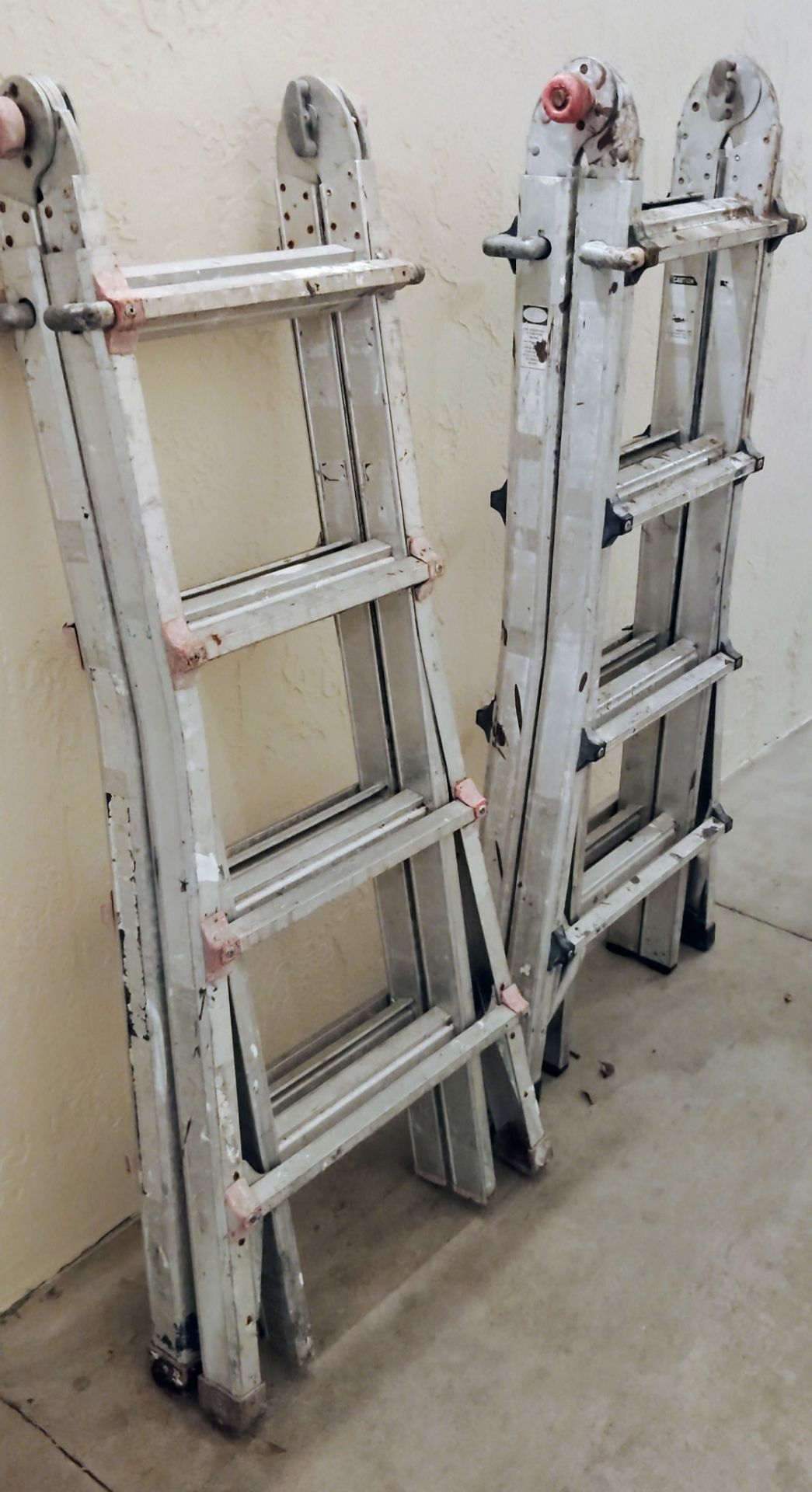 Two aluminum ladders