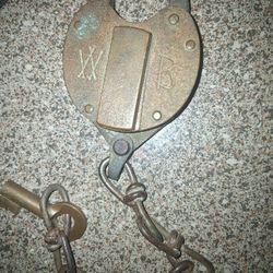 Old brass lock and two old wheat pennies