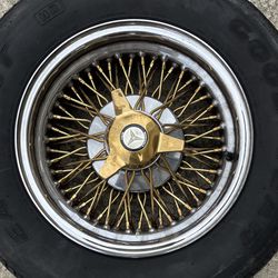 Wheels.  Mercedes’ Benz.  Gold Spokes.  Vintage.