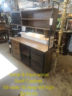 Metal and Faux Wood Shelf Cabinet We are located at 2811 East Bell road. Another Time Around Furniture.