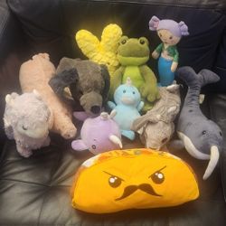 11 Plush Stuffed Toys, Mr. Taco, 3 Narwhal, Piggy, Rabbit, Dog, Mermaid, Frog, Peeps, Llama, Net Included all in pretty nice condition.