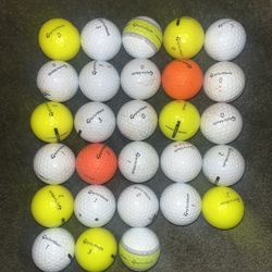28 Taylormade Golf Balls. 