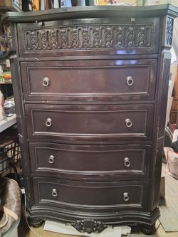 Dark Wood Tall Dresser with Ornate Carvings