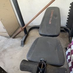 Bench Press With Bar And A Set If 25 Lbs Plates. 