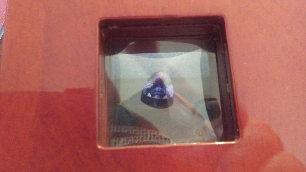 1.50 carat tanzanite trillion cut with paperwork