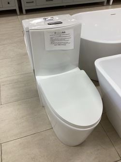 Single piece modern toilet, white, fully skirted, available for pick up