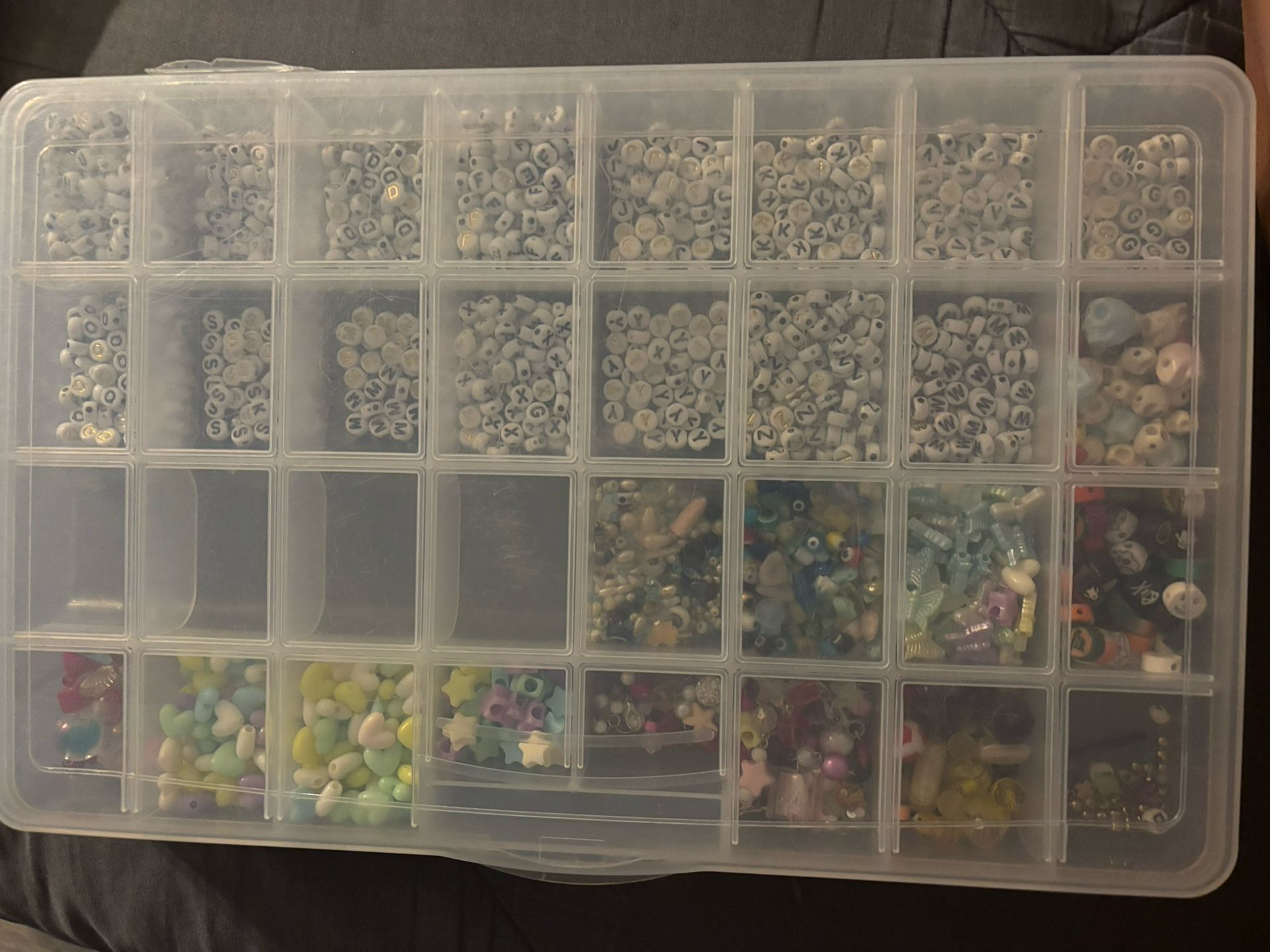 32 boxes with 15 letter beads and the rest random