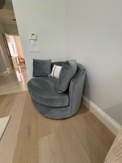 Two teal lounge chairs extra large with pillows