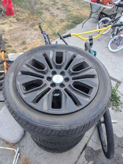 22-in tires and rim stock rims 6 lug