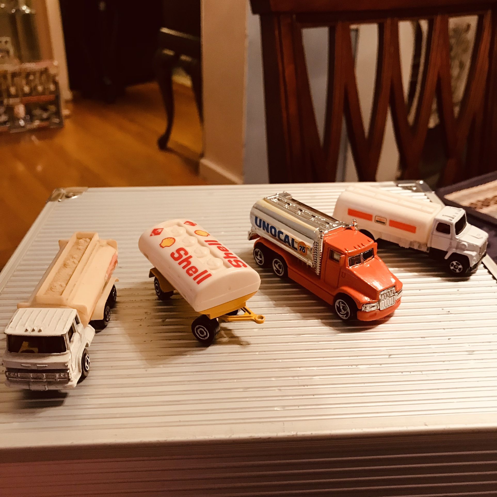 (4) 1/64 Oil Vehicles (2) Exxon Tankers (1)  Hong Kong (2)?  1991 Hot Wheels (Unocal 76) and Shell (?) NO INDIVIDUAL Sales 