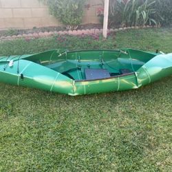 Foldable Tucktec Kayak with oars, life vest, and stabilizers 