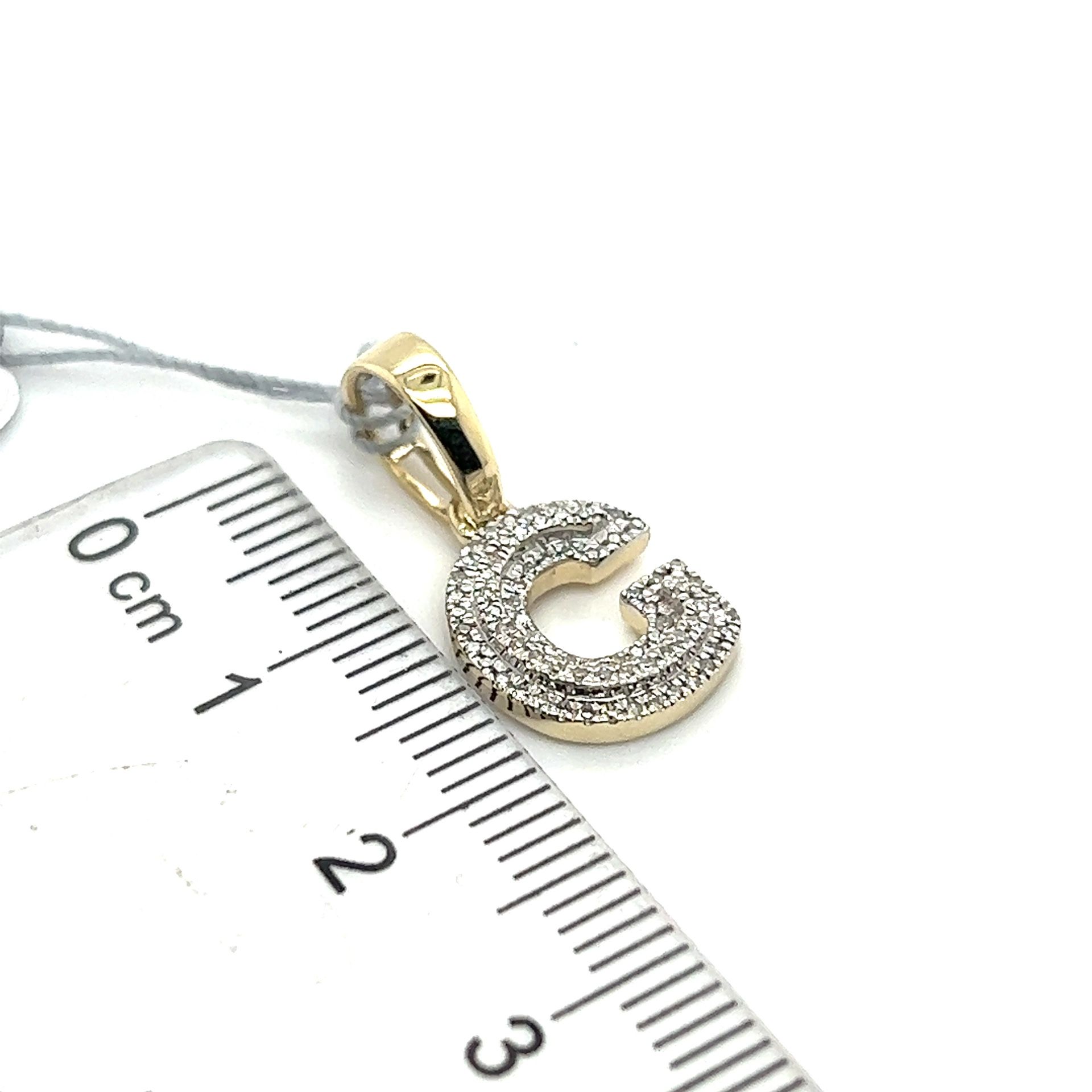 10kt Gold Diamond G Pendant 1.46grams 154125 1