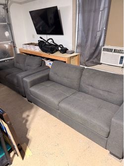 Two Matching Gray Fabric Loveseat Couch Sofa Set