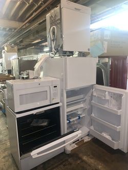 New 4 piece set: Top and bottom fridge, electric stove, microwave and dishwasher