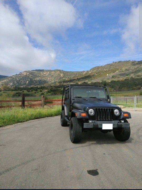 Jeep Wrangler TJ With Roof Rack Tires