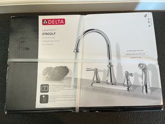 Delta Lewiston Two Handle Kitchen Faucet with sprayer. New in box.