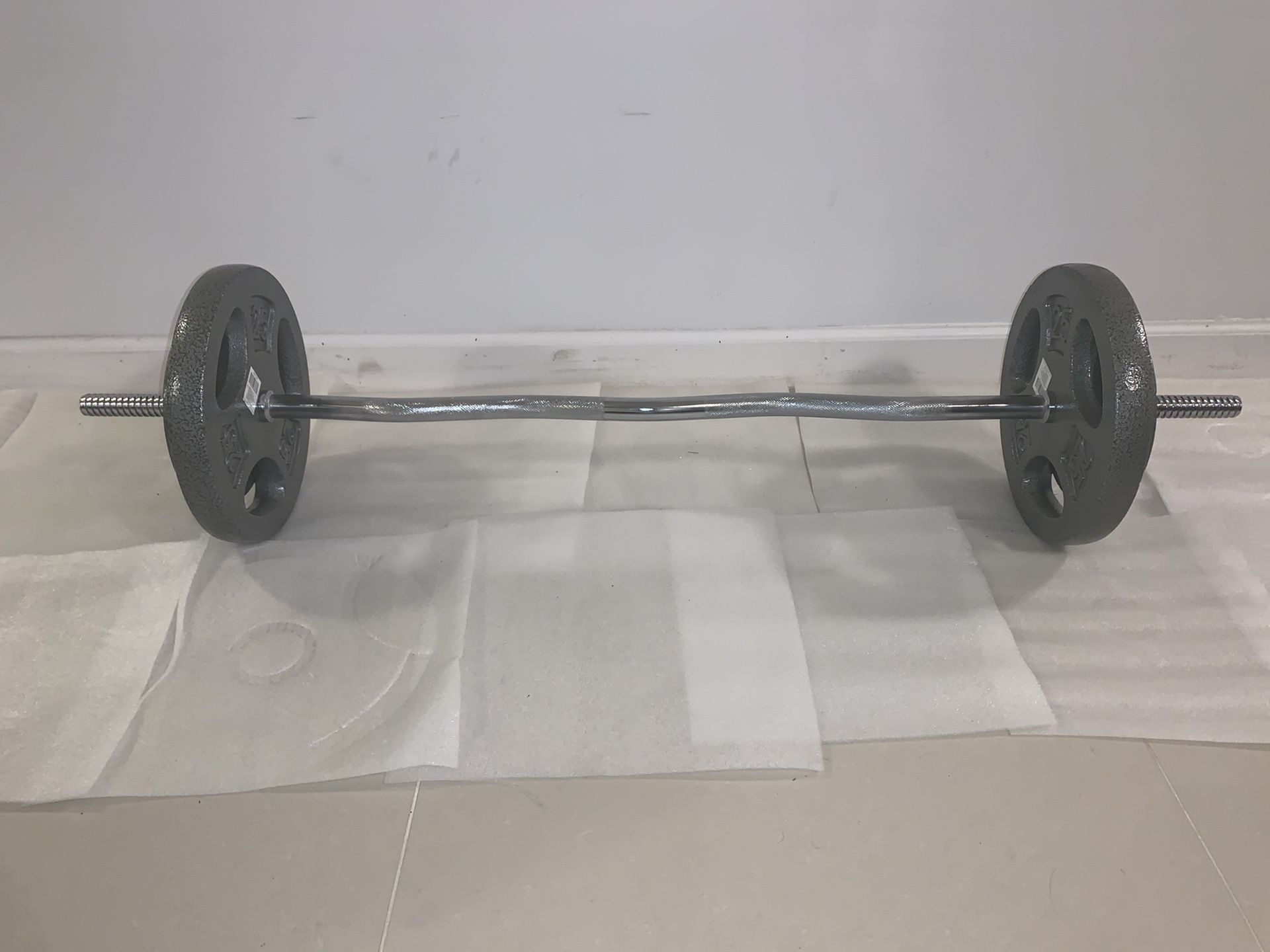 Standard 1’ EZ Curl Bar + 2 Collars + 25 lbs + 10 LBS 1’ Standard Plates. Everything Brand NEW With Tags.