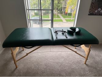 EarthLite portable massage table — dark green