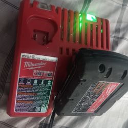 Milwaukee M12 M18 Battery Charger With 1.5 Battery In Good Conditions 