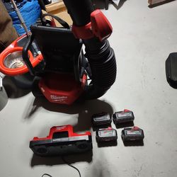 Milwaukee battery operated blower with 4  8.0 batteries abd a super charger. Hardly useed