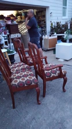 Four Dinning Chairs with a burgnandy pattern good condition