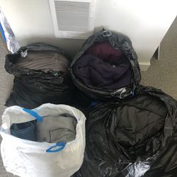 4 large bags with women's clothing sizes L, XL, 2XL and men's clothing sizes S, M. 10$ bag
