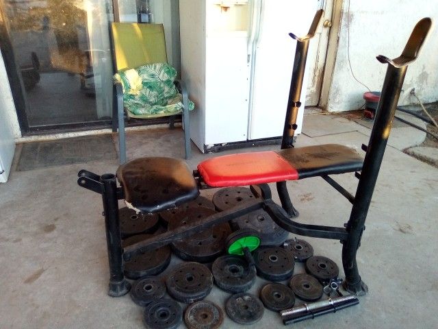 Weight bench with weights plates only no bar / total weight 160 lb. /Hesperia CA /pick up only) $75