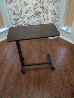 Tattoo arm rest that raises