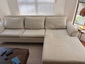 Cream L-Shaped Couch with Peg Legs
