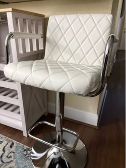 Set of two adjustable swivel bar/counter stools with arms