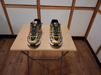Men's Nike P 6000 size 9 brand new black gold