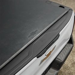 Genuine OEM 2024– 2026 SILVERADO EV | TONNEAU BED COVER | SOFT ROLL-UP | BLACK | MIDGATE PASSTHROUGH | BOWTIE LOGO