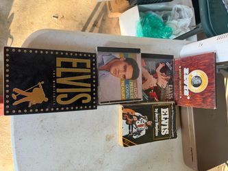 Elvis collection of dvd and cds and a paperback book