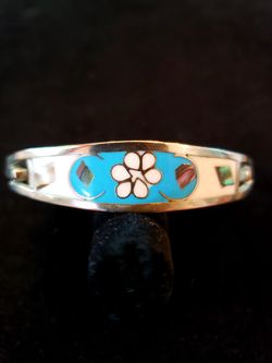 $15. Alpaca Mexico baby blue and white enamel bracelet with inlaid abalone shell. Fits wrist up to 7.5 in. NOT STERLING.