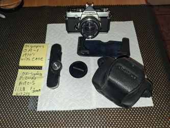 Olympus om-1 camera 1970s with case and zuiko lens. All sales final.