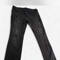 Black distressed skinny jeans with a flare leg. Size: 40x32" #distresseddenim #flarejeans #denim