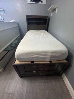 Grey wooden twin bed with storage drawers and shelves Mattress included
